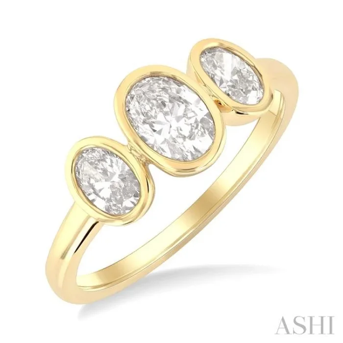 1 Ctw 3-Stone Bezel Set Oval Cut Diamond Ring in 14K Yellow Gold