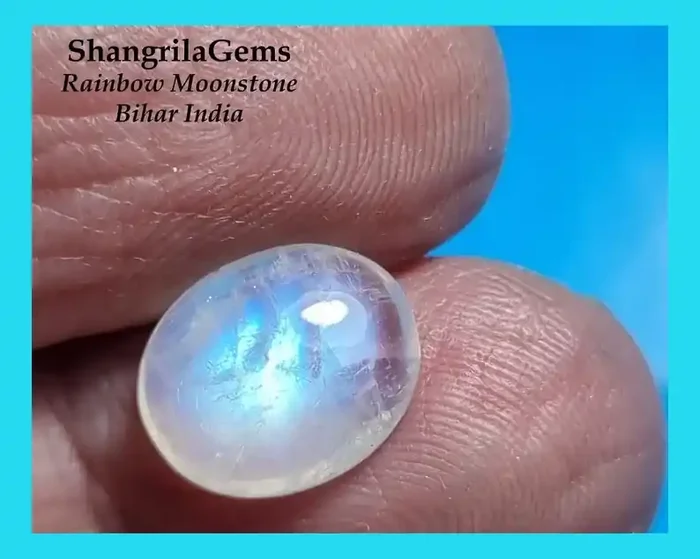 11mm oval rainbow moonstone 11.1 by 9by 5.2mm 8.4ct