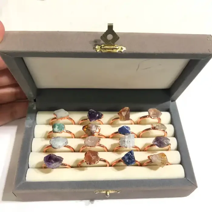 16 Raw Gemstones in copper rings Br 2450