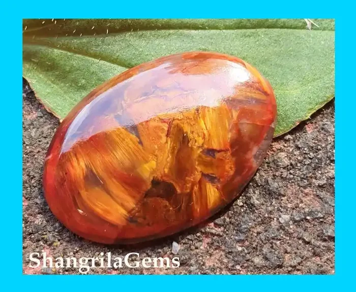 23mm Red Pietersite oval cabochon from Namibia 23 by 16 by 3mm 7cts