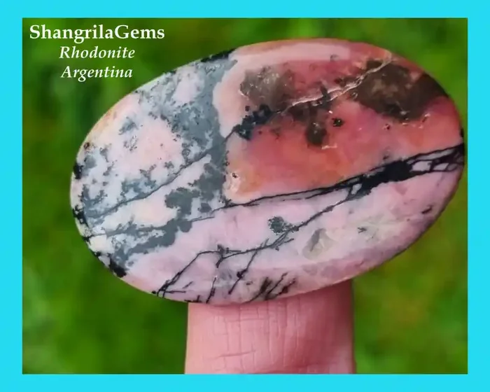 43mm oval Rhodonite cabochon 56ct 43 by 27 by 4mm Argentina