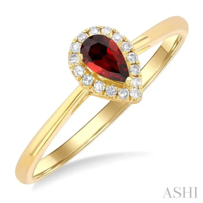 5×3 MM Pear Shape Garnet and 1/20 Ctw Single Cut Diamond Halo Semi-Precious Ring in 14K Yellow Gold