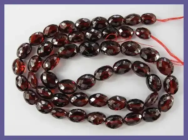 “RAVISHING AAA 5X7-7X9MM MOZAMBIQUE GARNET FACETED OVAL BEADS!!”