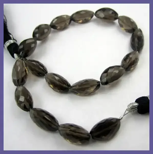 AAA GLORIOUS CARAMEL SMOKEY QUARTZ 5X9-6X13MM CARDAMON BEAD STRAND