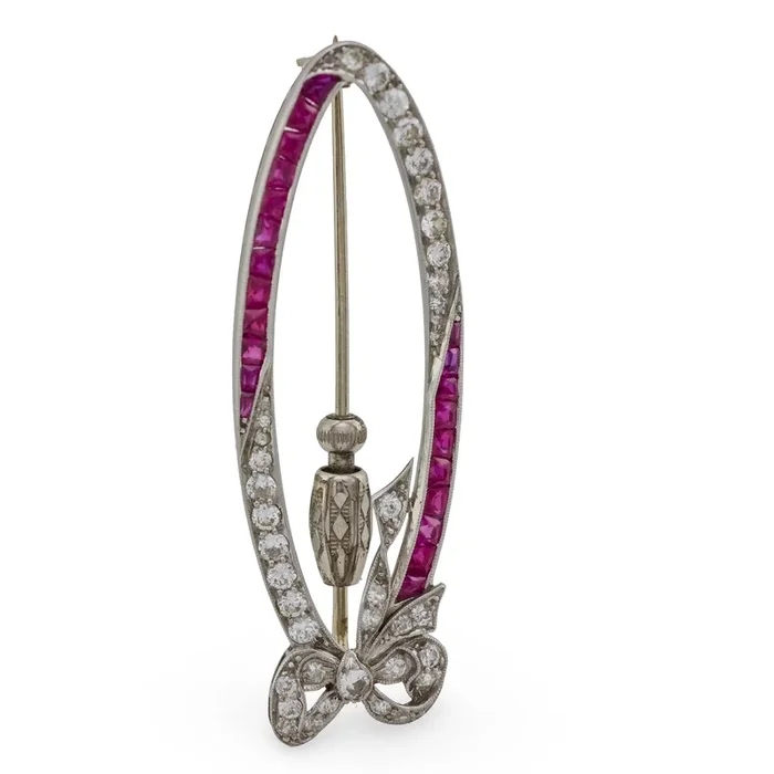 Art Deco diamond ruby platinum oval bow brooch