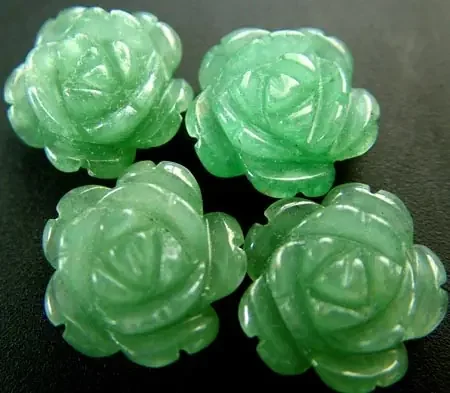 FOUR ADVENTURINE FLOWER CARVINGS-1/2 DRILLED 31.45CTS MX4789