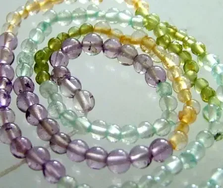 FOUR DIFERENT COLOURFUL STONES IN STRAND 23.10 CTS GT 1618