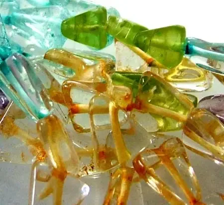 FOUR DIFERENT COLOURFUL STONES IN STRAND 46.45 CTS GT 1589