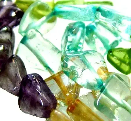 FOUR DIFERENT COLOURFUL STONES IN STRAND 54.00 CTS GT 1590