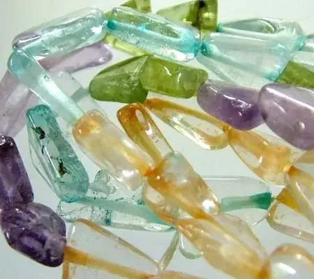 FOUR DIFERENT COLOURFUL STONES IN STRAND 55.35 CTS GT 1572