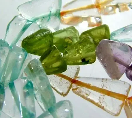 FOUR DIFERENT COLOURFUL STONES IN STRAND 62.70 CTS GT 1634