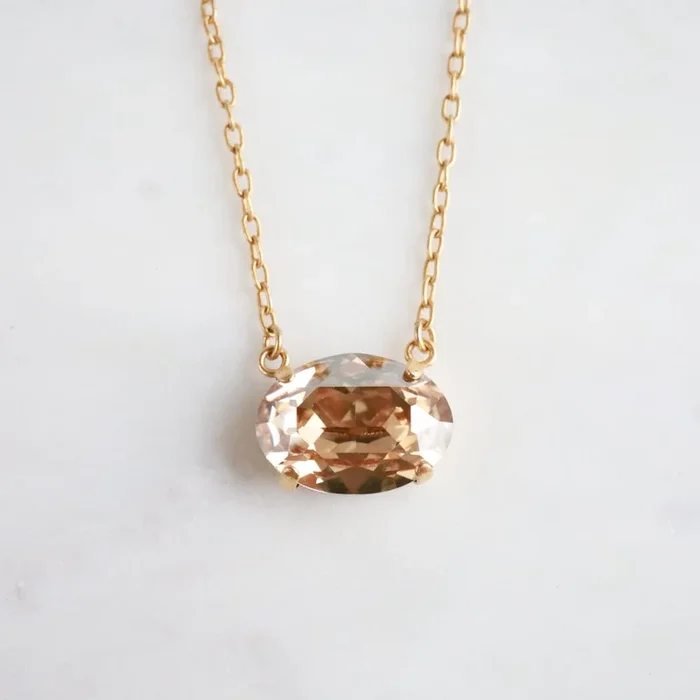 Gold Oval Crystal Pendant – Champagne