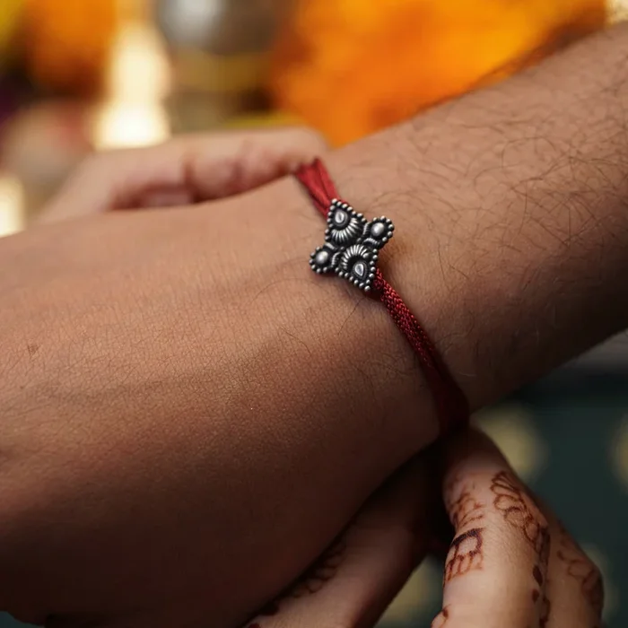Handcrafted Silver Rakhi/Pendant: Chandrakor & Drop Motif