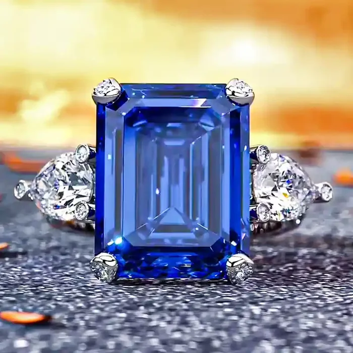Helloice Emerald Cut & Pear Shaped Sapphire & Diamond Three-Stone Ring in Sterling Silver