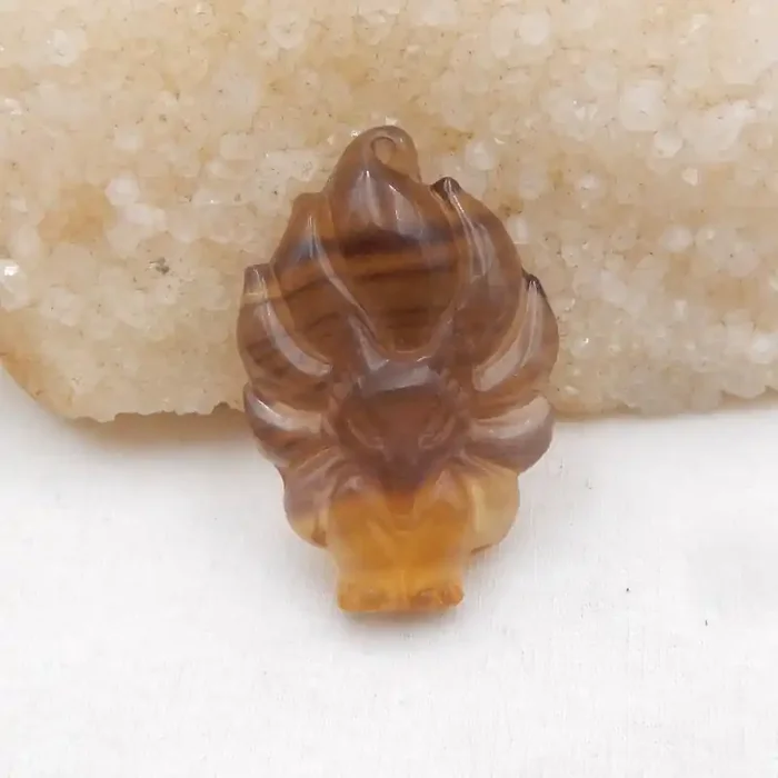 i115 – 107cts Carved Natural Fluorite Fox Pendant Front Driled