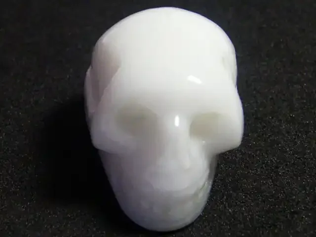MILKY WHITE QUARTZ SKULL SKELETON CARVING 93.35GRAMS AG6702
