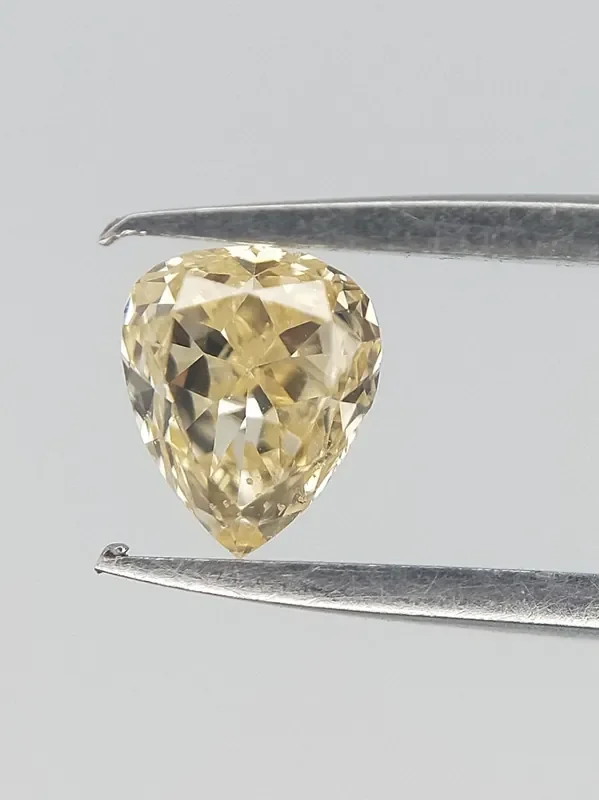 Natural yellow Diamond , Pear Brilliant cut 0.15 CTS