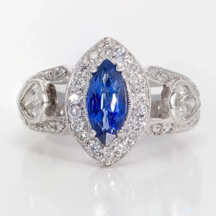 Ninacci Platinum Halo Ring with Marquise Sapphire and Pave-Set Diamonds – 1.20 Carat Total Diamond Weight