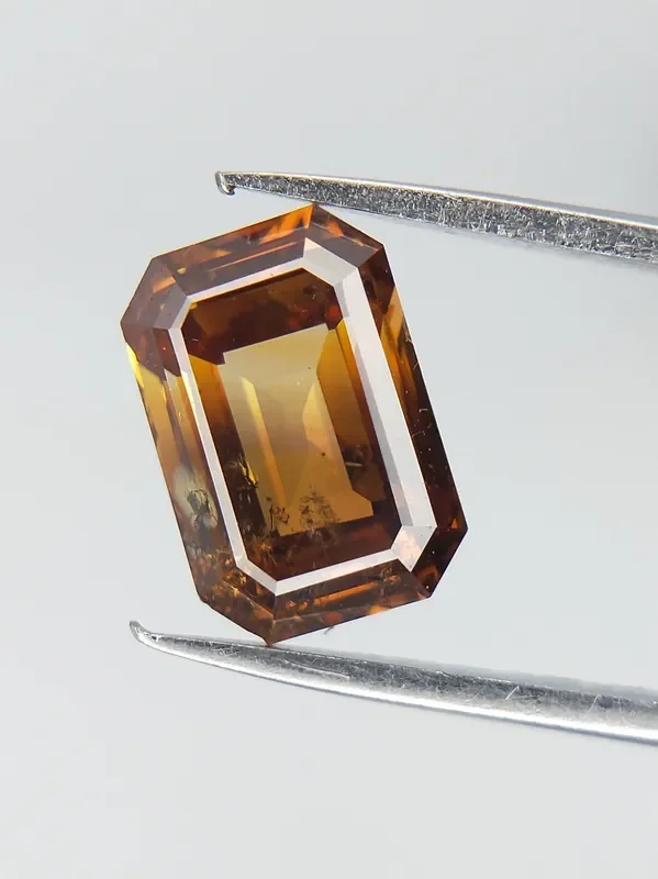 Orangy Yellow Diamond , Emerald Cut Diamond Orange Diamond 0.81 CTS