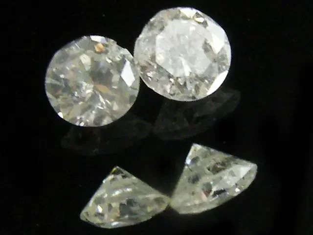 PAIR SI1 SILVER DIAMOND .123 CARATS 2.5 POINTERS OP1422