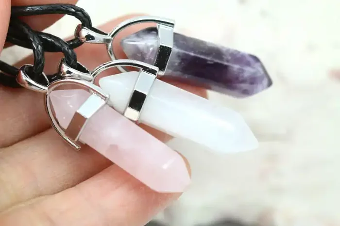 Three double pointed Gemstone Pendants NA 446